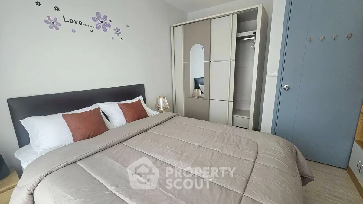 Cozy bedroom with modern decor and ample storage space