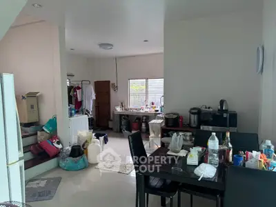 Spacious kitchen and dining area with modern appliances and ample natural light.