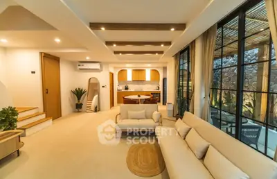 Luxurious open-plan living room with modern kitchen and stylish decor