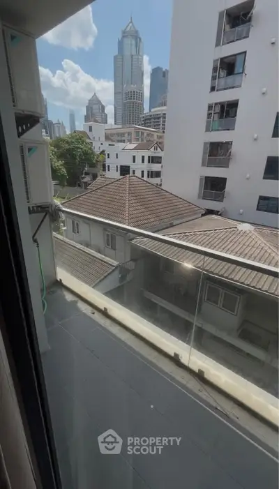 Urban balcony view with city skyline and modern architecture