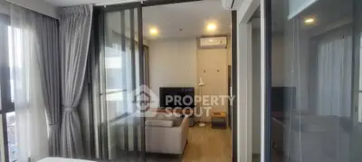 Modern living room with glass partition and cozy seating area