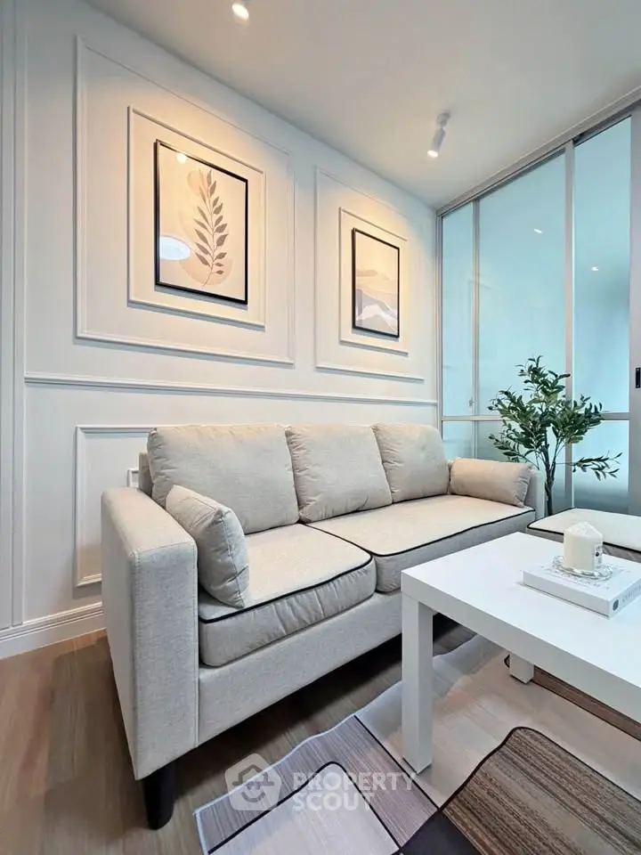 Modern living room with stylish decor and cozy beige sofa, perfect for relaxation and entertaining.