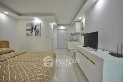 Modern studio apartment with sleek design and cozy living space