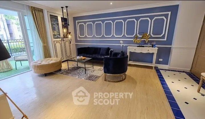 Elegant living room with stylish decor and access to balcony