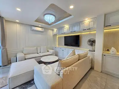 Luxurious living room with elegant lighting and modern furniture, perfect for relaxation and entertainment.