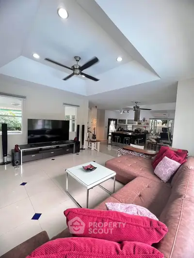 Spacious modern living room with stylish decor and open layout, perfect for family gatherings.