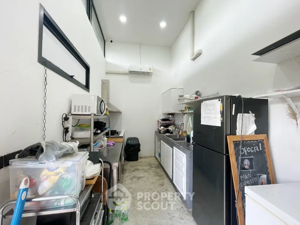 Spacious kitchen with modern appliances and ample storage space