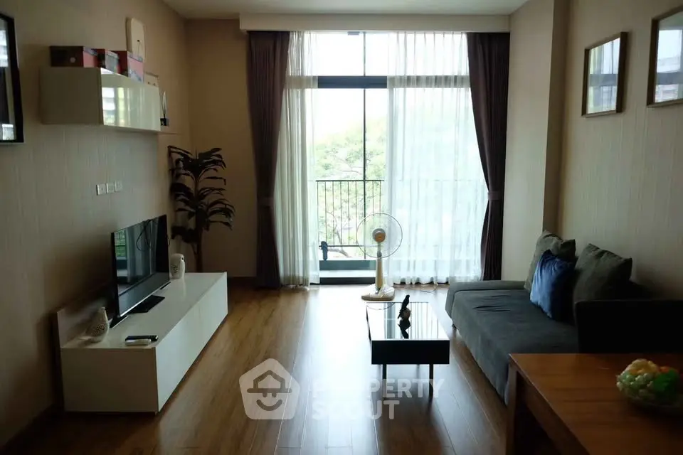 Modern living room with large window and stylish decor