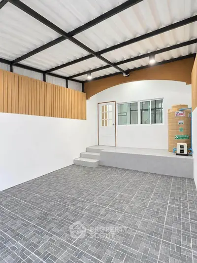 Spacious modern garage with tiled flooring and wooden accents, perfect for secure parking or storage.