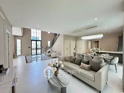 Luxurious open-plan living room with elegant decor and modern furnishings