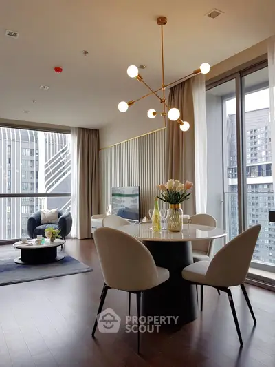 Luxurious modern living room with elegant dining area and stunning city view.