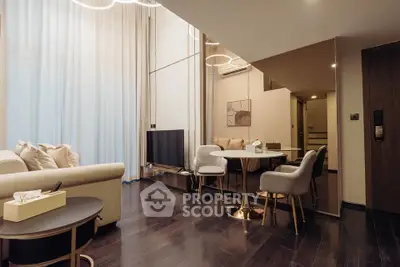 Luxurious modern living room with elegant decor and high ceilings