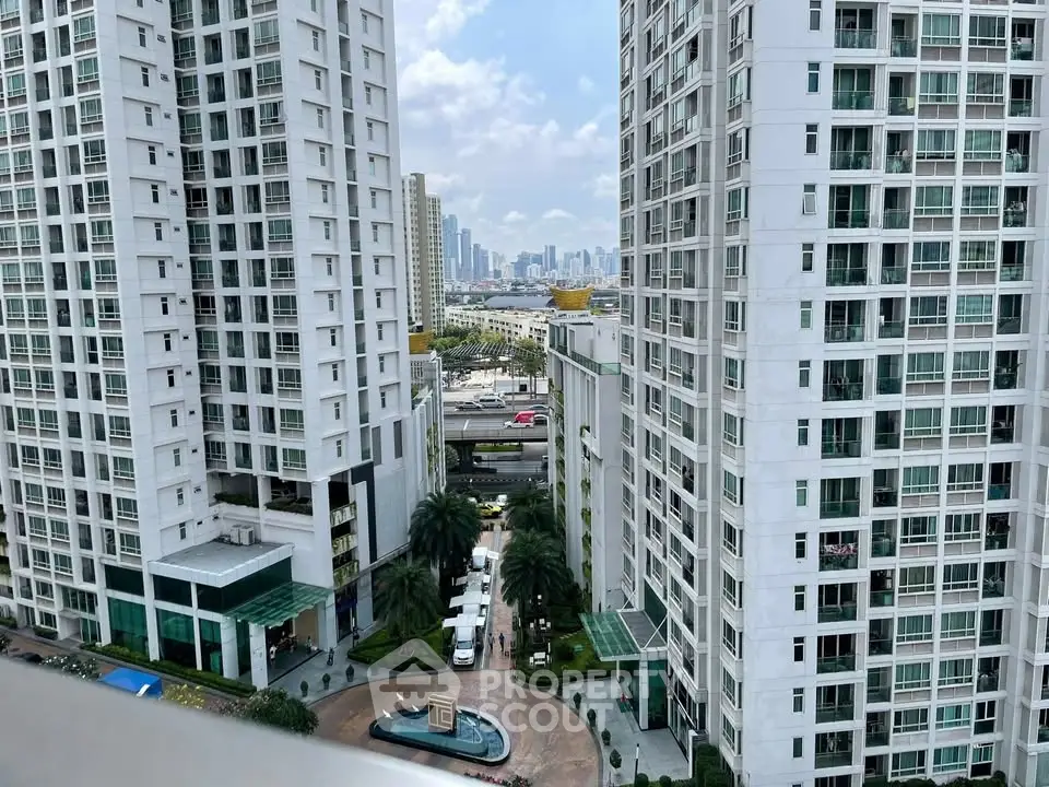 Stunning urban high-rise buildings with city skyline view, featuring modern architecture and lush landscaping.