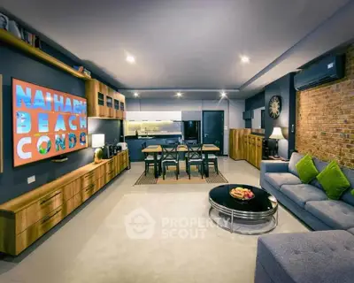 Spacious modern living room with open kitchen in beach condo