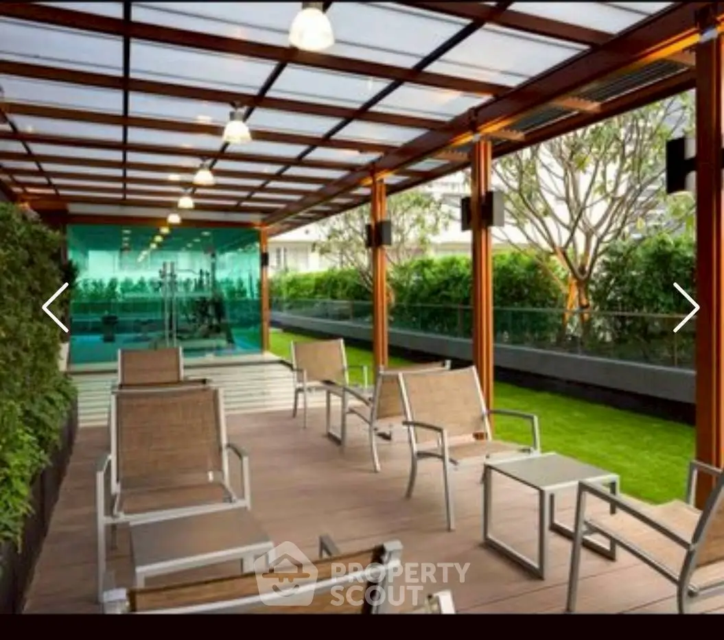 Luxurious rooftop terrace with modern seating and lush greenery