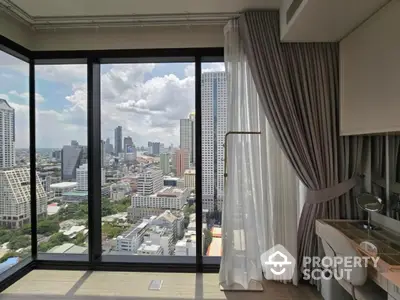 Stunning city view from modern high-rise apartment with floor-to-ceiling windows