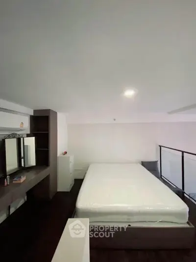 Modern bedroom with sleek design and ample storage space