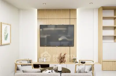 Modern living room with stylish decor and wall-mounted TV
