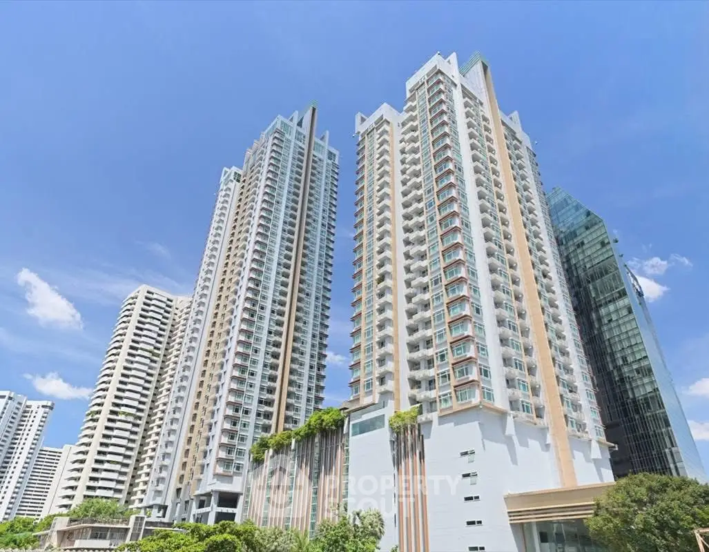 Stunning high-rise residential buildings with modern architecture and lush greenery.