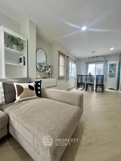 Spacious modern living room with elegant dining area and stylish decor