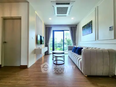 Modern living room with elegant decor and large window view