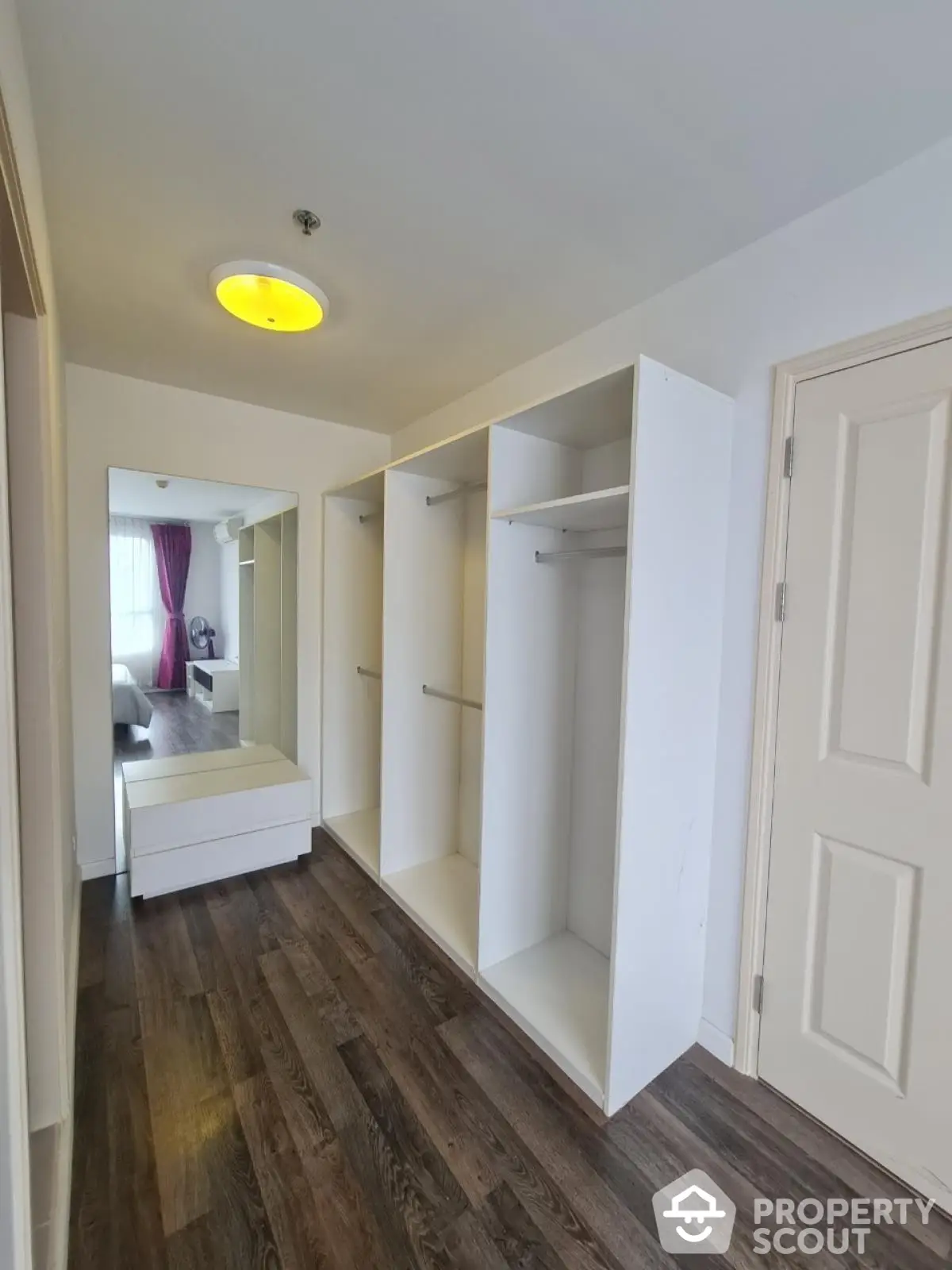 Spacious walk-in closet with modern design and ample storage space