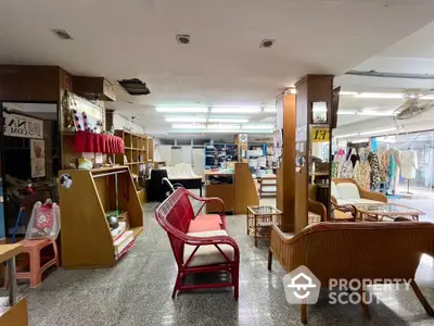 Spacious commercial interior with modern decor and ample seating in prime location