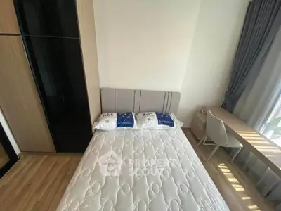 Modern bedroom with stylish furniture and natural light, perfect for a cozy living experience.