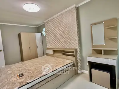 Modern bedroom with stylish furniture and elegant wall design