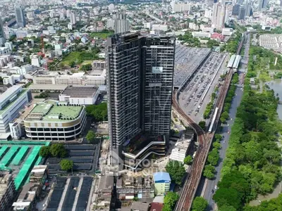 Stunning aerial view of a modern high-rise building in a bustling urban landscape.