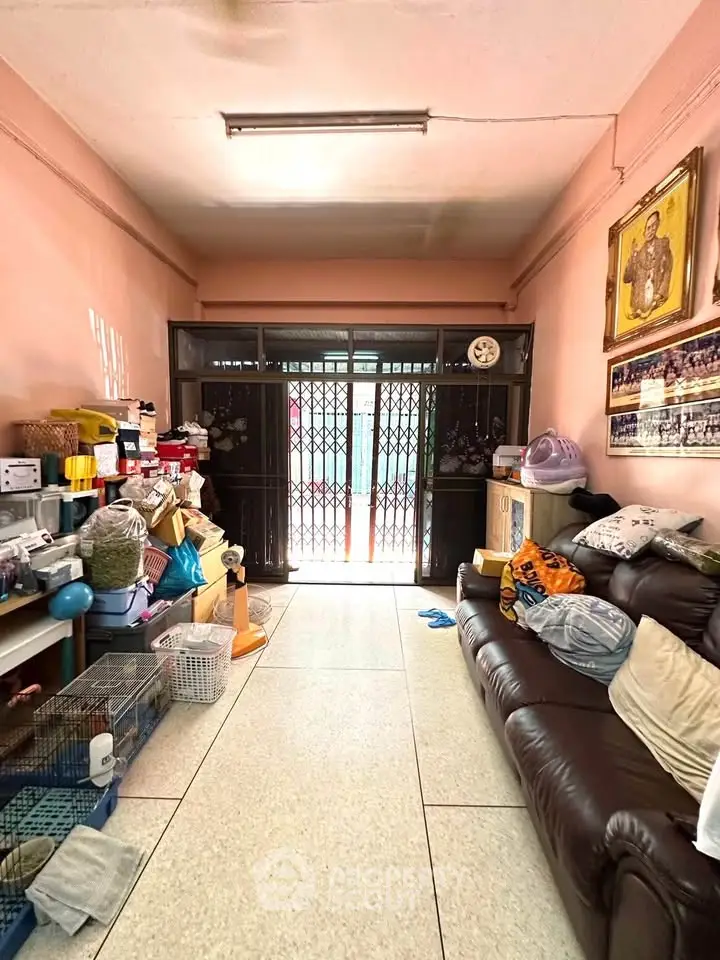 Cozy living room with leather sofa and ample natural light