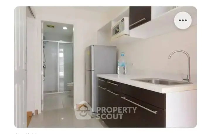 Modern kitchen with sleek cabinets and stainless steel appliances