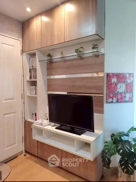 Modern living room with stylish wooden TV cabinet and decorative plants