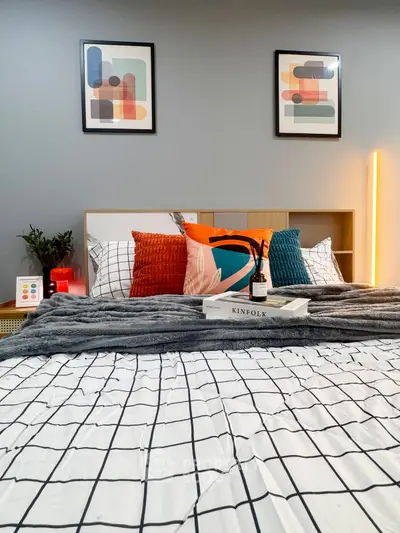 Modern bedroom with stylish decor and cozy bedding