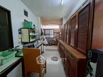 Charming kitchen with ample storage and natural light, perfect for culinary enthusiasts.