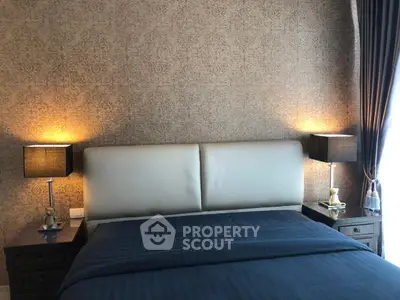 Luxurious bedroom with elegant wallpaper and cozy lighting