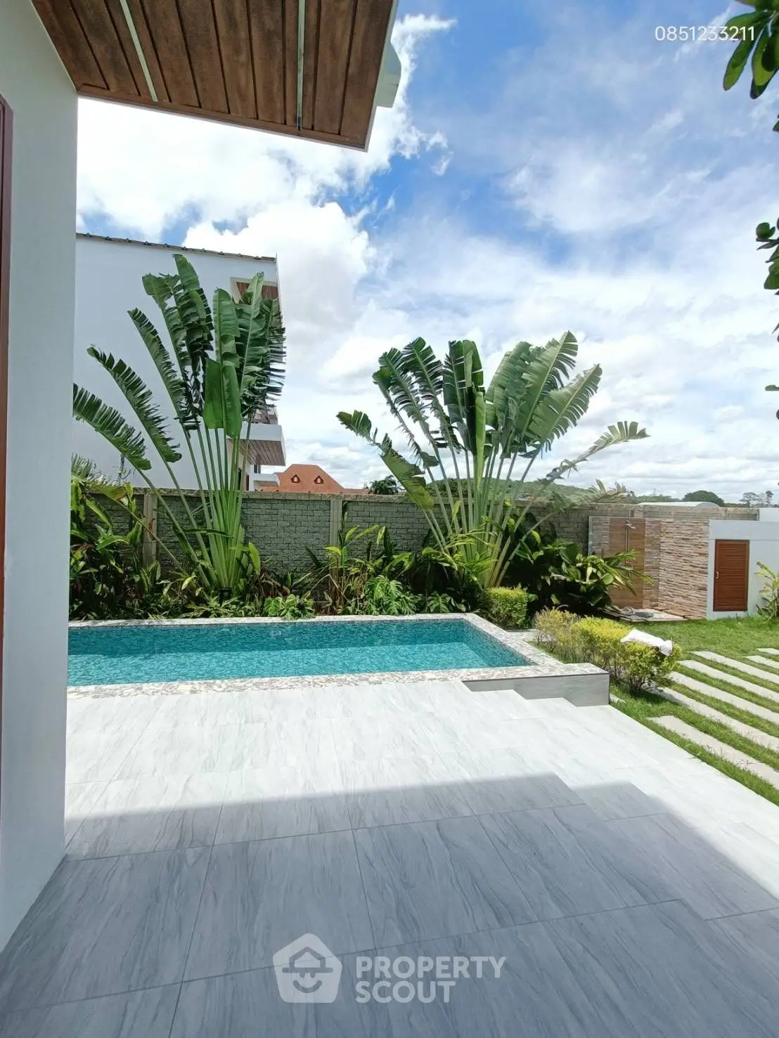 Luxurious modern villa with private pool and lush garden, perfect for relaxation and entertaining.