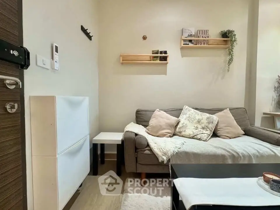 Cozy living room with modern decor and comfortable seating in a stylish apartment.