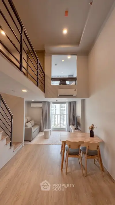 Modern duplex apartment with open living area and stylish decor