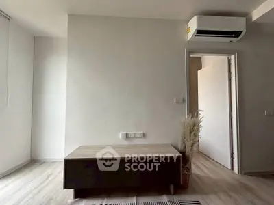 Minimalist interior with air conditioning and wooden flooring, perfect for modern living.