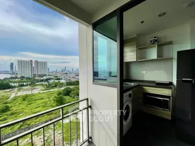 Modern apartment kitchen with stunning city view and balcony access