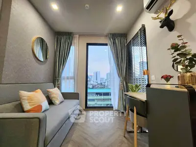 Stylish living room with city view, modern decor, and cozy ambiance.
