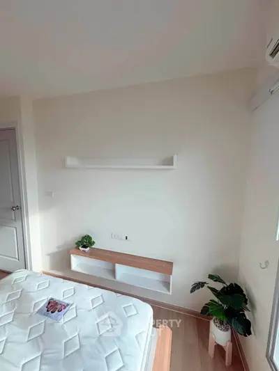Modern bedroom with minimalist decor and natural light
