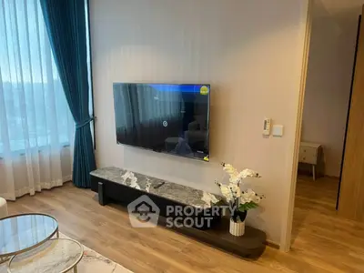 Modern living room with wall-mounted TV and elegant decor