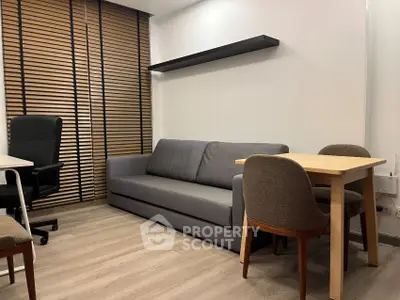 Modern living room with sleek furniture and wooden blinds, perfect for urban living.