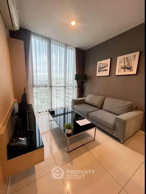 Modern living room with large windows and stylish decor