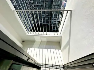 Modern balcony with city view in high-rise apartment