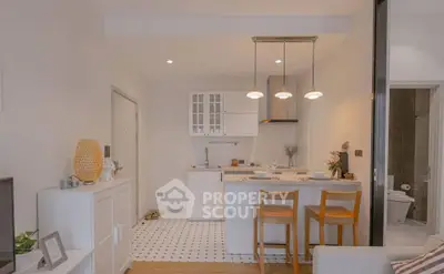 Charming open-layout kitchen with modern design and cozy dining area