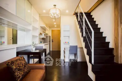 Modern duplex interior with stylish staircase and cozy living area