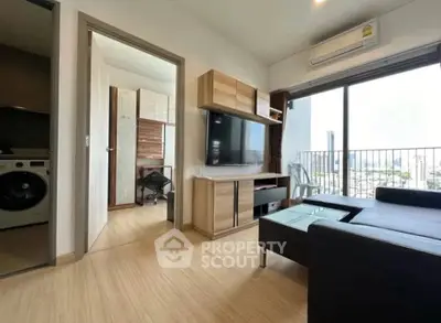 Modern living room with balcony view and sleek furniture in urban apartment
